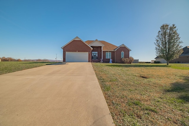 ranch-style home with a garage and a front lawn