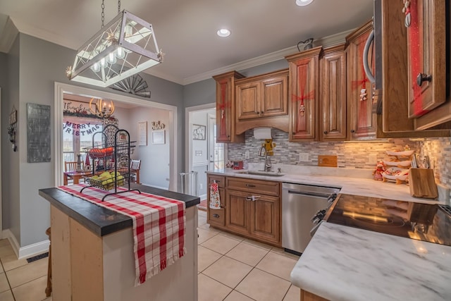 kitchen with stainless steel dishwasher, crown molding, sink, light tile patterned floors, and pendant lighting