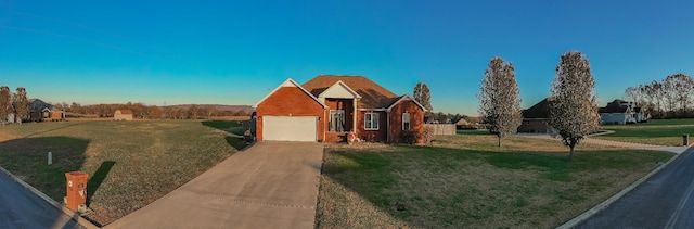 view of front of home with driveway and a front lawn