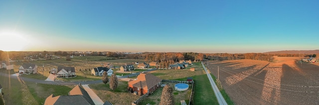 birds eye view of property with a rural view