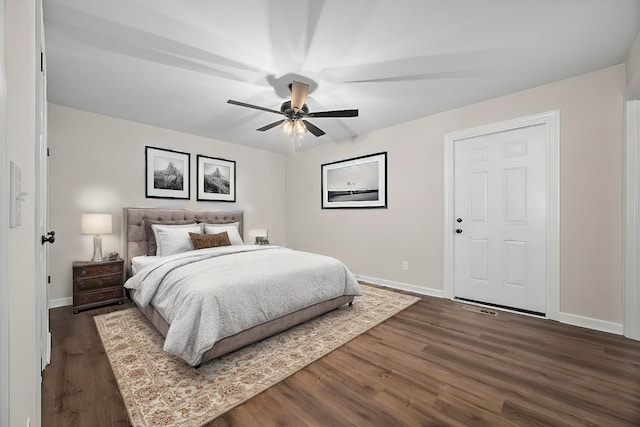 bedroom featuring ceiling fan and dark hardwood / wood-style floors