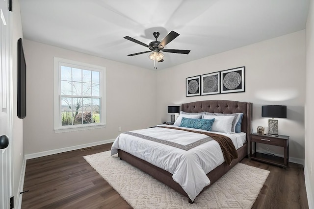 bedroom with dark wood-type flooring and ceiling fan