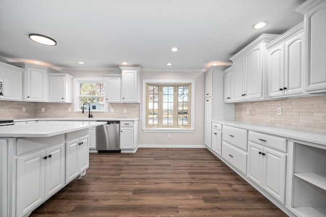 kitchen featuring dishwasher, dark wood-type flooring, white cabinets, and crown molding