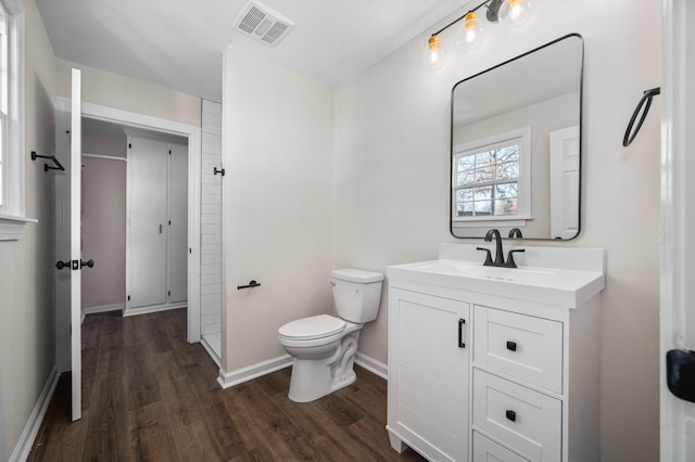 bathroom with vanity, hardwood / wood-style floors, and toilet