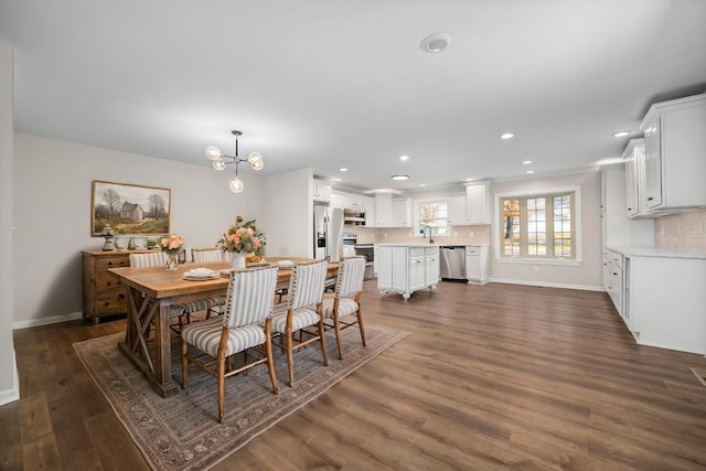 dining area featuring dark hardwood / wood-style flooring