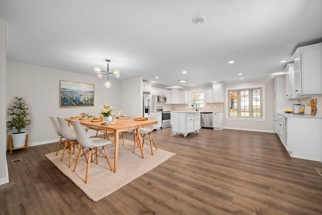 dining area with recessed lighting, baseboards, and dark wood-style flooring