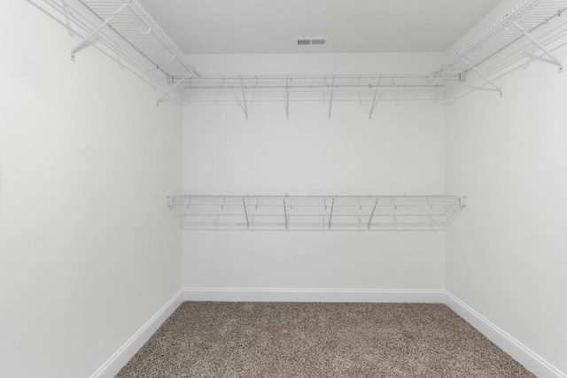 walk in closet with carpet flooring and visible vents