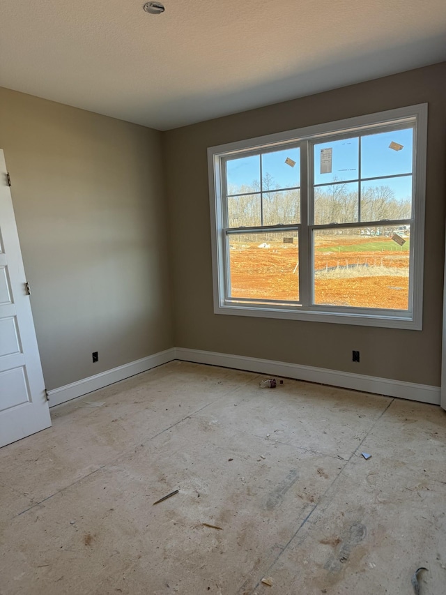 empty room with baseboards