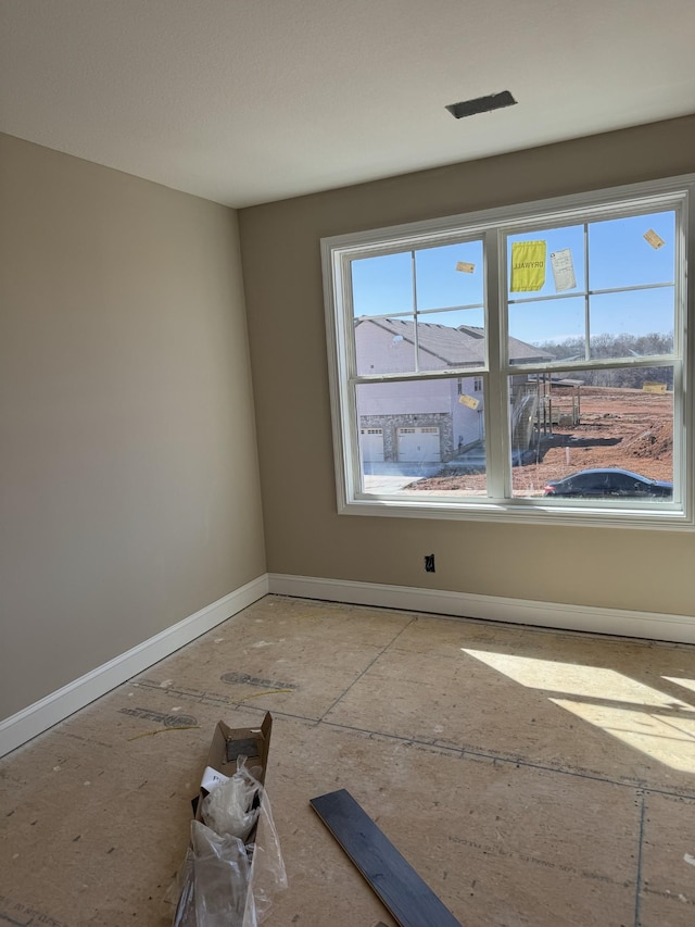 empty room with baseboards