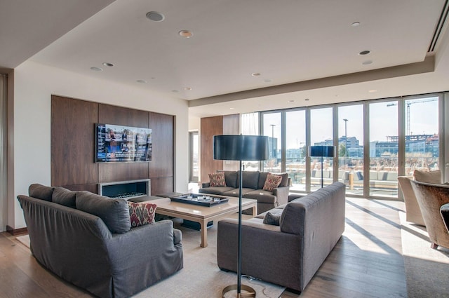 living room featuring plenty of natural light and light wood-type flooring