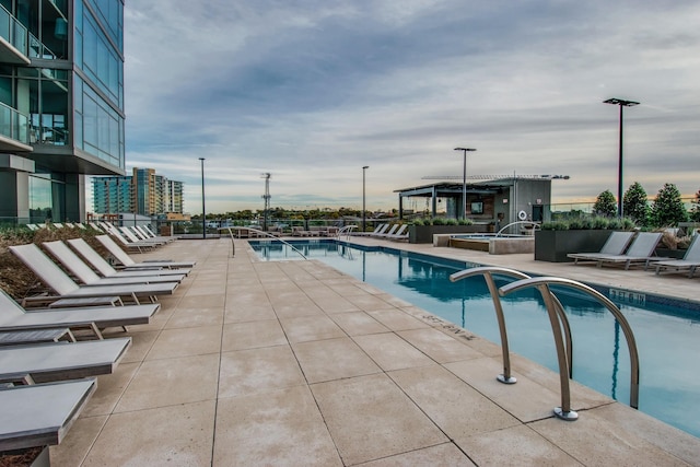 view of swimming pool featuring a patio area