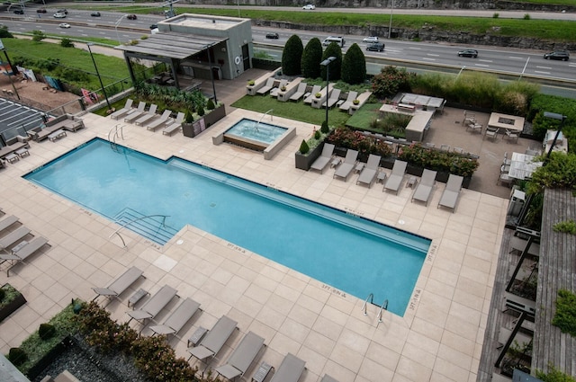 view of swimming pool featuring a patio area