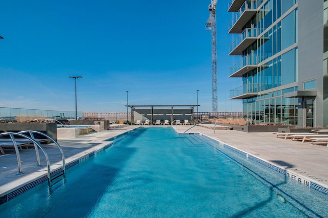 view of swimming pool featuring a patio