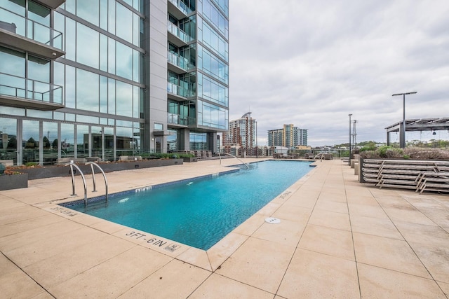 view of pool featuring a patio