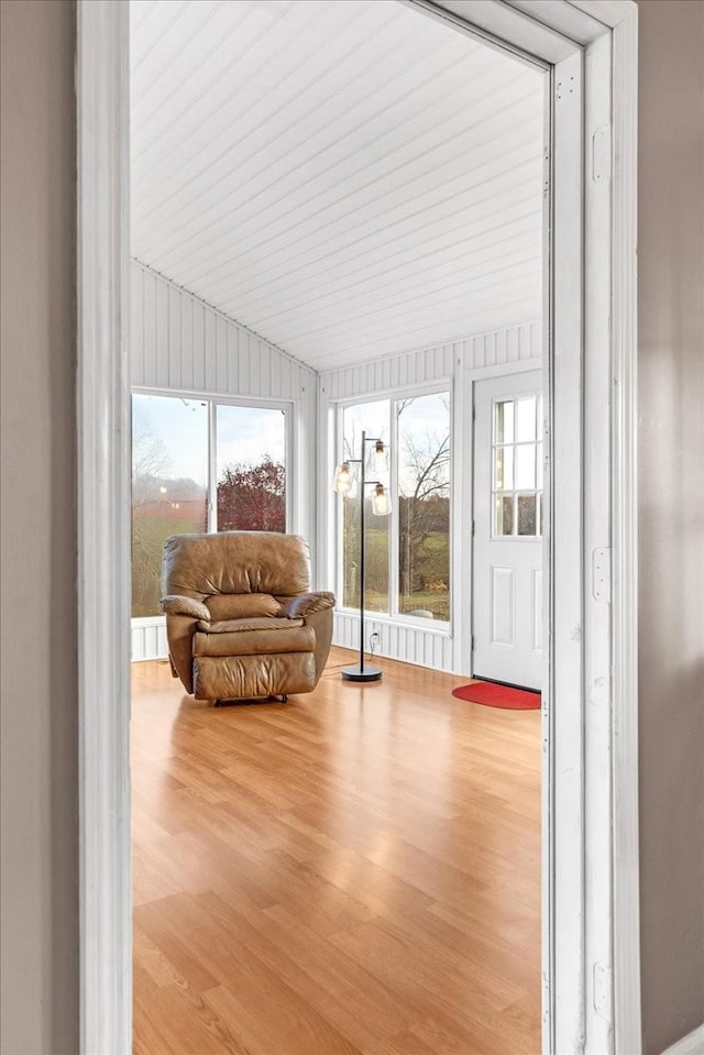 sunroom / solarium with a wealth of natural light and lofted ceiling