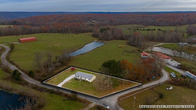 birds eye view of property featuring a water view and a rural view