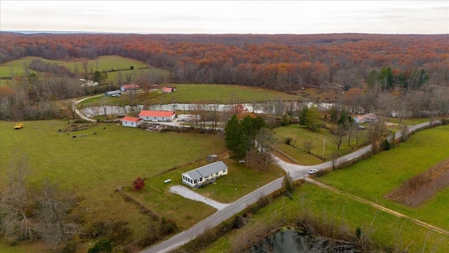 drone / aerial view featuring a water view and a rural view