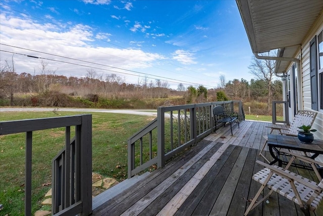 deck featuring a lawn