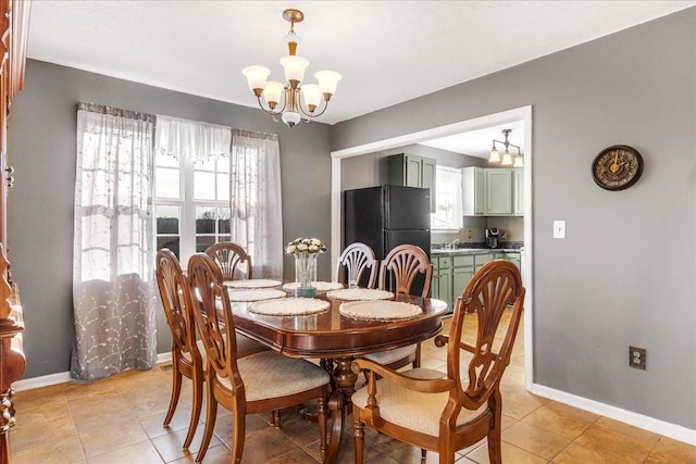 tiled dining space featuring a wealth of natural light and a chandelier