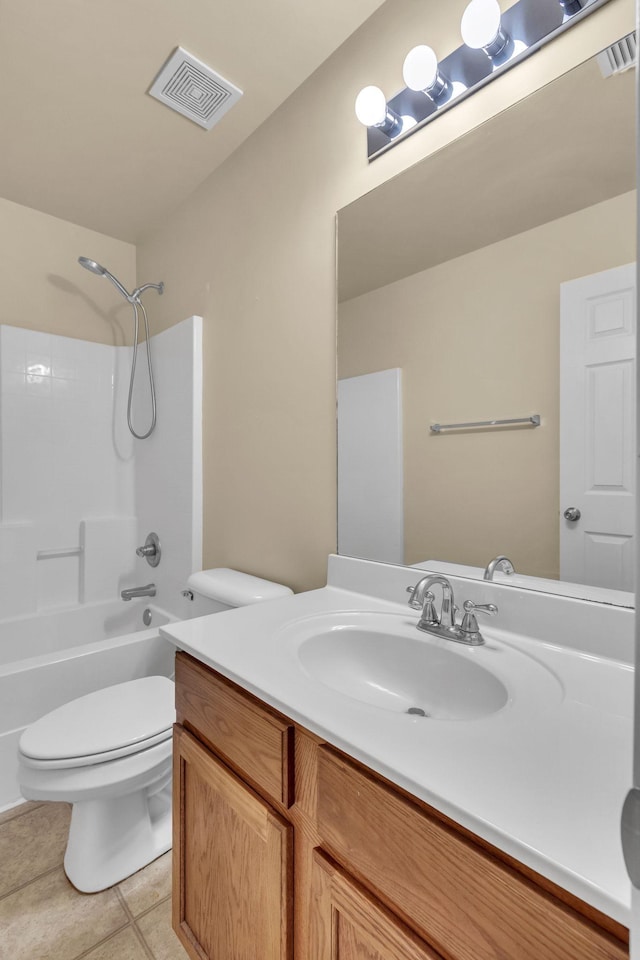 full bathroom featuring tile patterned floors, vanity, toilet, and bathing tub / shower combination