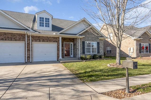 view of front of house with a garage and a front lawn