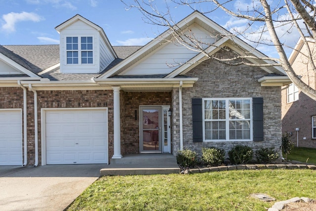 view of front of house with a front lawn and a garage