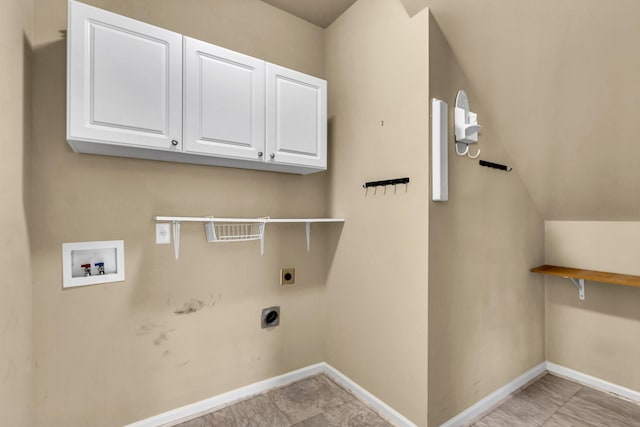 washroom with hookup for an electric dryer, cabinets, and washer hookup