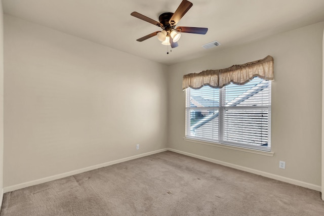 carpeted empty room with ceiling fan