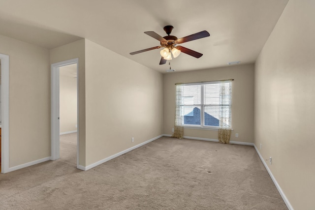 carpeted empty room with ceiling fan