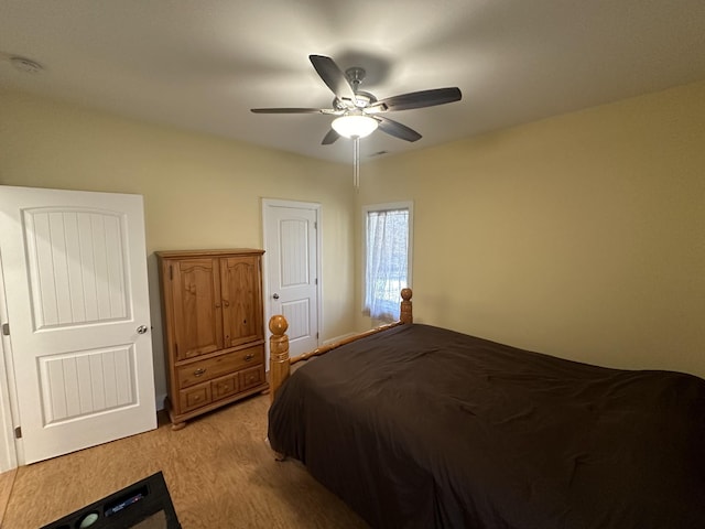 bedroom featuring ceiling fan and light hardwood / wood-style floors