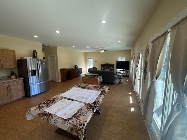 interior space featuring carpet, plenty of natural light, and ceiling fan