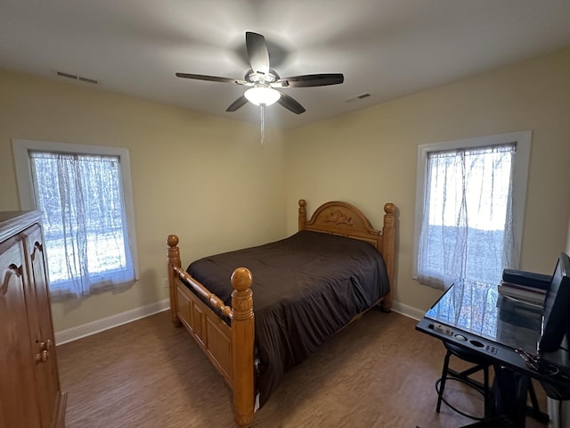 bedroom with hardwood / wood-style flooring and ceiling fan