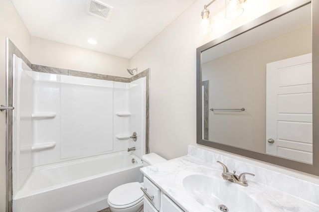 bathroom featuring visible vents, toilet, vanity, and  shower combination