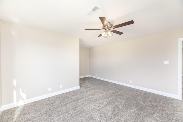 unfurnished room with visible vents, a ceiling fan, baseboards, and carpet floors