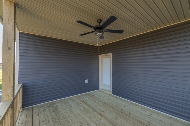 wooden deck with a ceiling fan