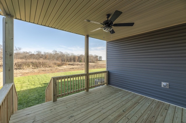 deck featuring a lawn and a ceiling fan