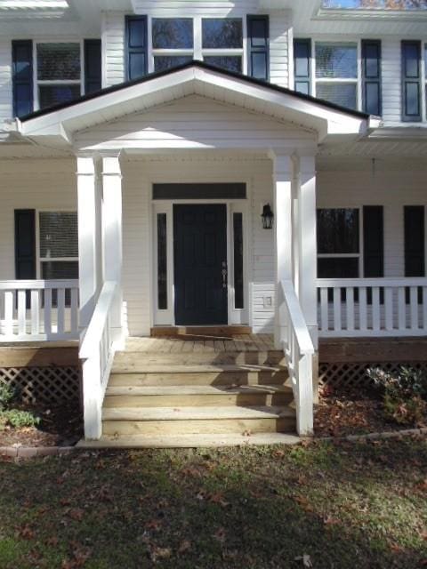 property entrance with covered porch