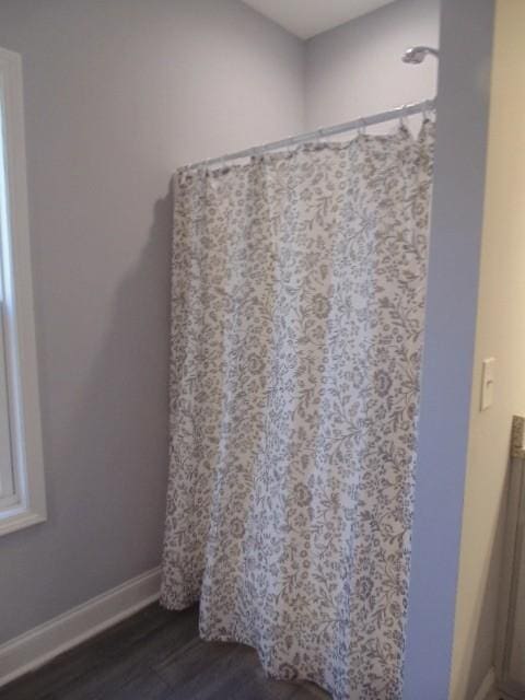 bathroom featuring hardwood / wood-style floors, vanity, and a shower with curtain