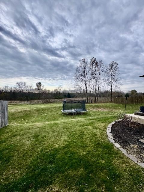 view of yard with a trampoline