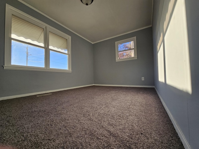 unfurnished room featuring carpet floors and crown molding