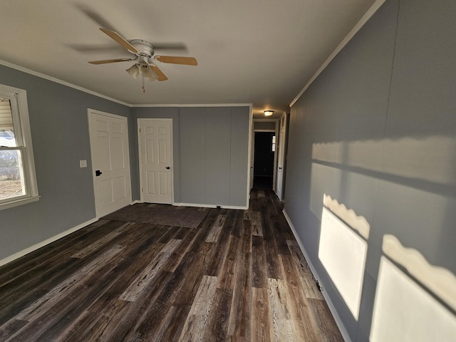 unfurnished bedroom featuring ceiling fan, dark hardwood / wood-style flooring, and ornamental molding