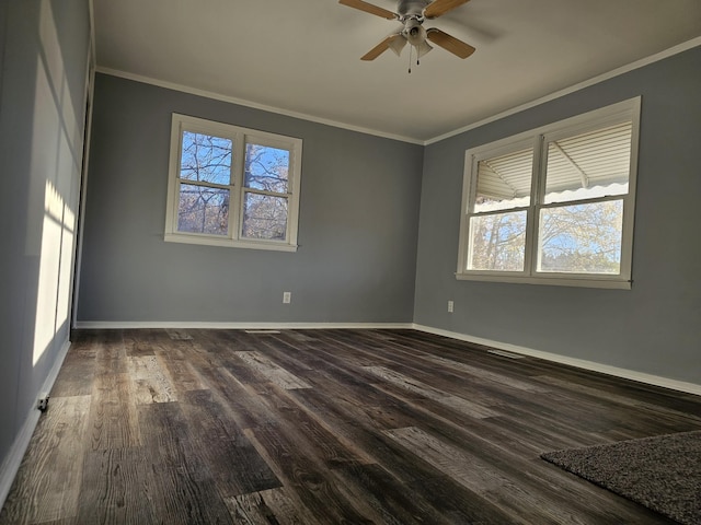 unfurnished room featuring crown molding, a wealth of natural light, and dark wood-type flooring