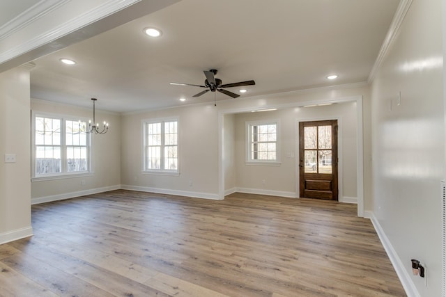 entryway with crown molding, light hardwood / wood-style flooring, and ceiling fan with notable chandelier