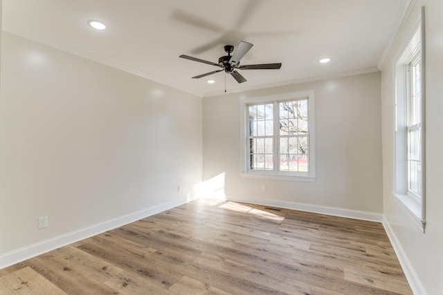 empty room featuring crown molding, ceiling fan, and light hardwood / wood-style floors