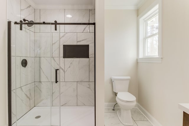 bathroom with toilet, a shower with door, and crown molding