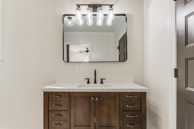 bathroom with vanity, ceiling fan, and ornamental molding