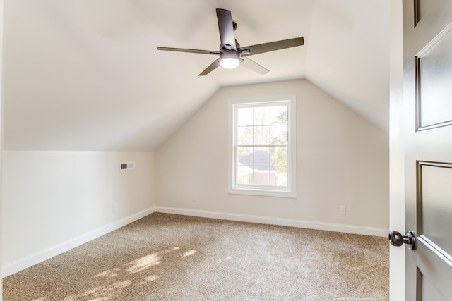 bonus room featuring ceiling fan, carpet, and vaulted ceiling