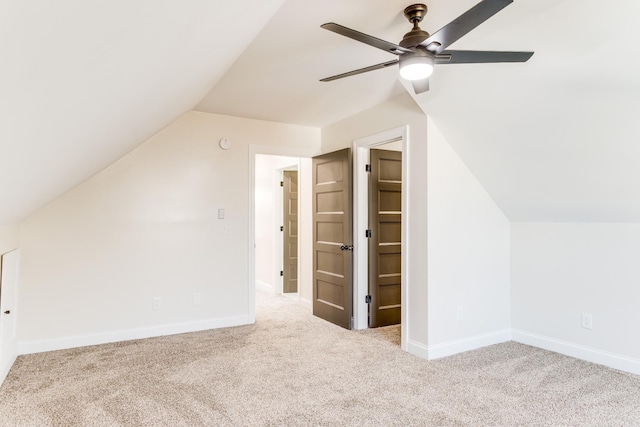 bonus room with light carpet, ceiling fan, and lofted ceiling