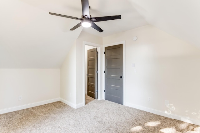 additional living space with carpet, ceiling fan, and vaulted ceiling