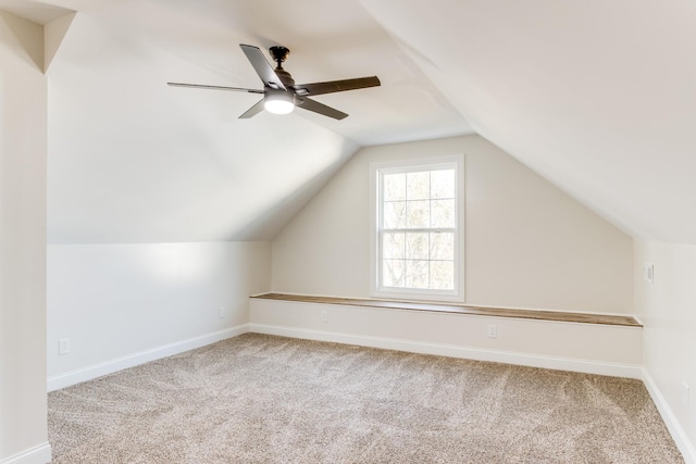 bonus room featuring ceiling fan, carpet floors, and vaulted ceiling